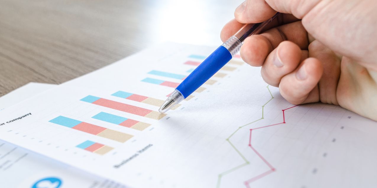 A venture capital client reviews business statistics.