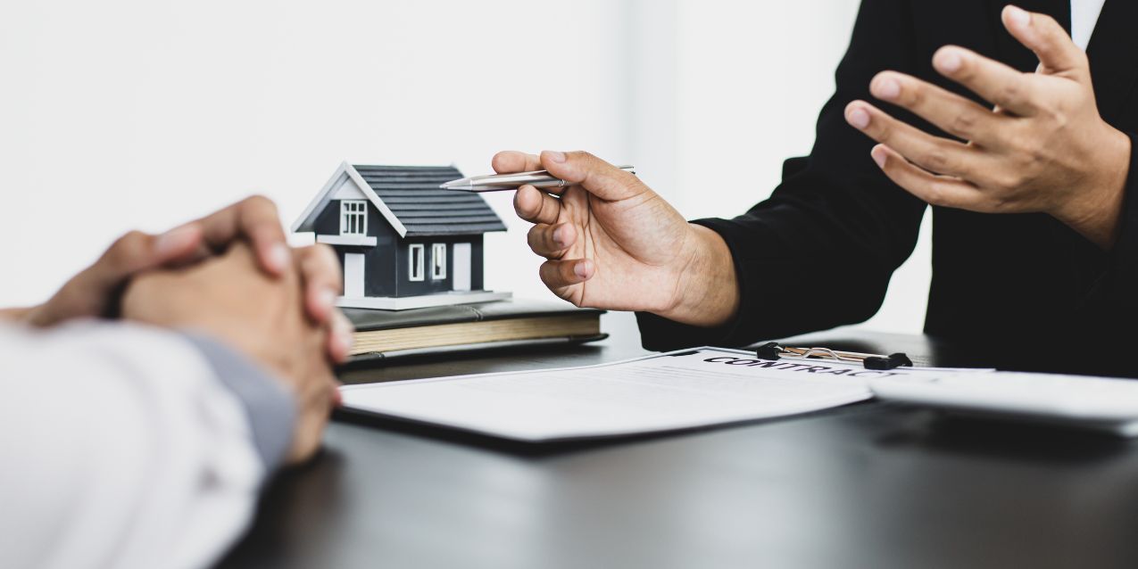 Attorney and client discuss purchasing property.