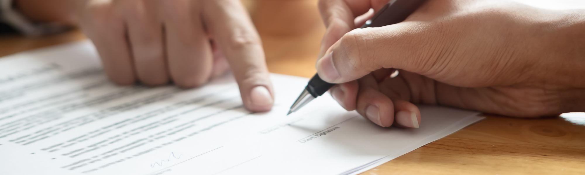 Client signs a lease with assistance from an attorney.